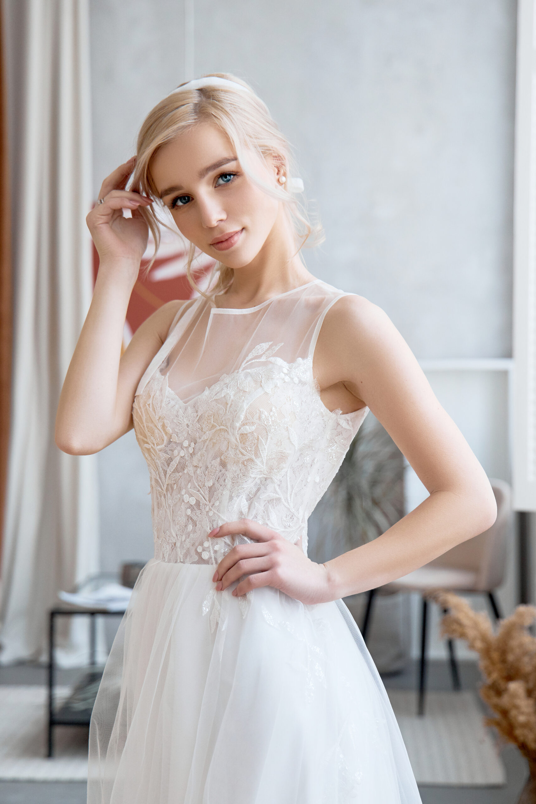 Blonde girl in a beautiful white wedding dress. A woman bride is waiting for the groom before the wedding