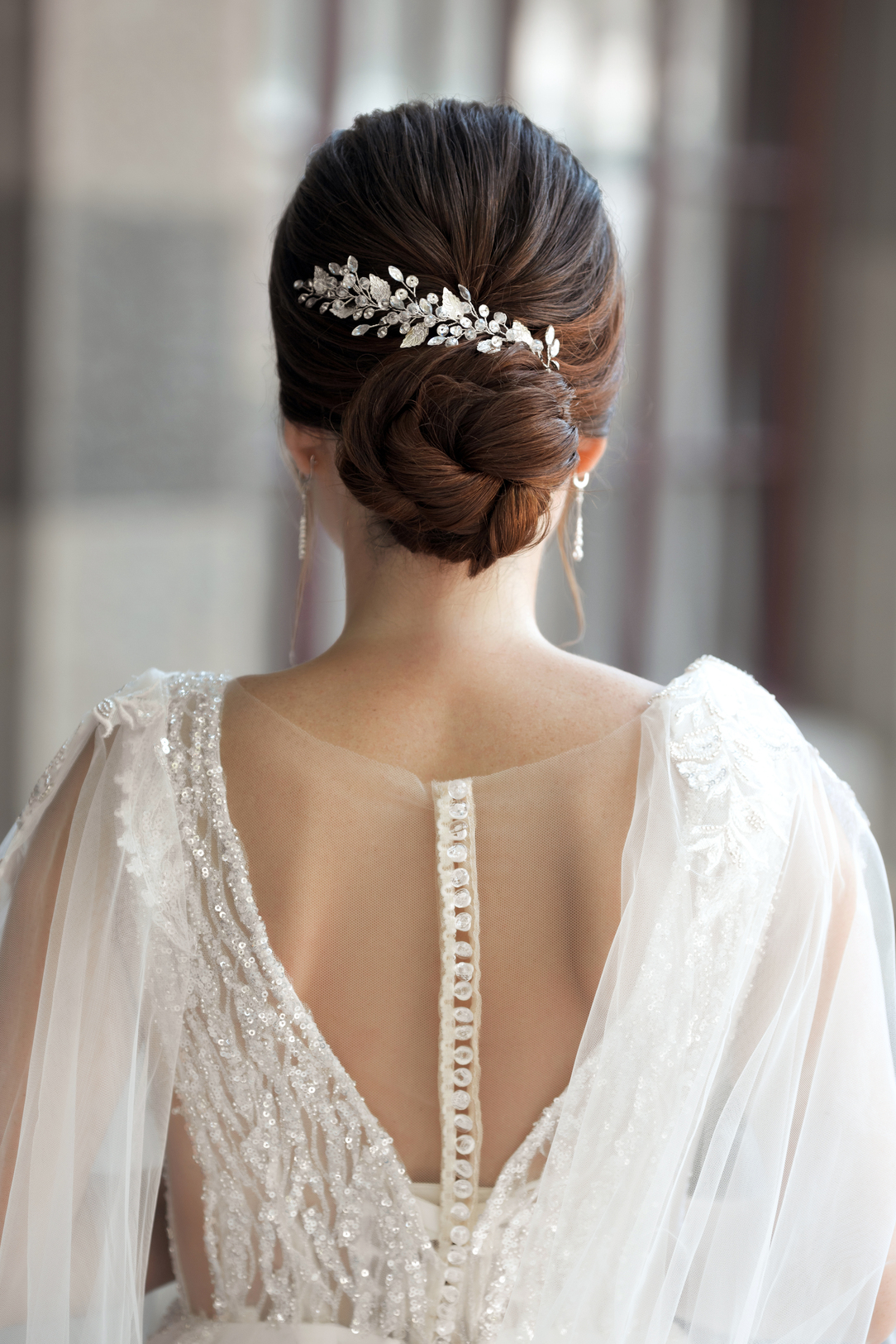 bride-in-wedding-dress-from-behind-with-glam-bun-h-2023-02-10-09-52-52-utc