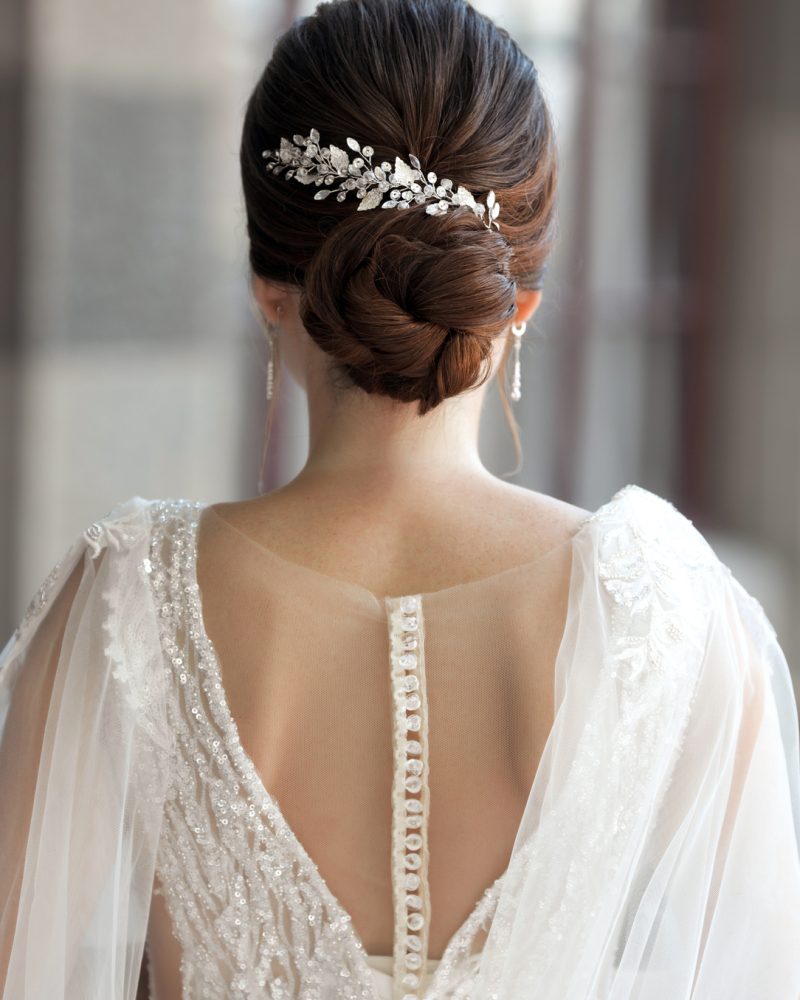 bride-in-wedding-dress-from-behind-with-glam-bun-h-2023-02-10-09-52-52-utc