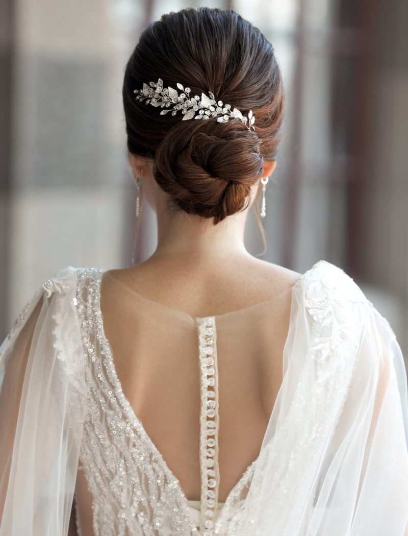 bride-in-wedding-dress-from-behind-with-glam-bun-h-2023-02-10-09-52-52-utc