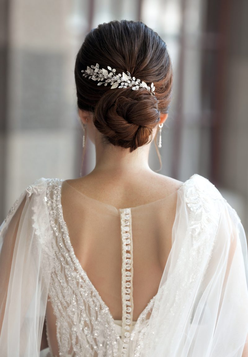 bride-in-wedding-dress-from-behind-with-glam-bun-h-2023-02-10-09-52-52-utc