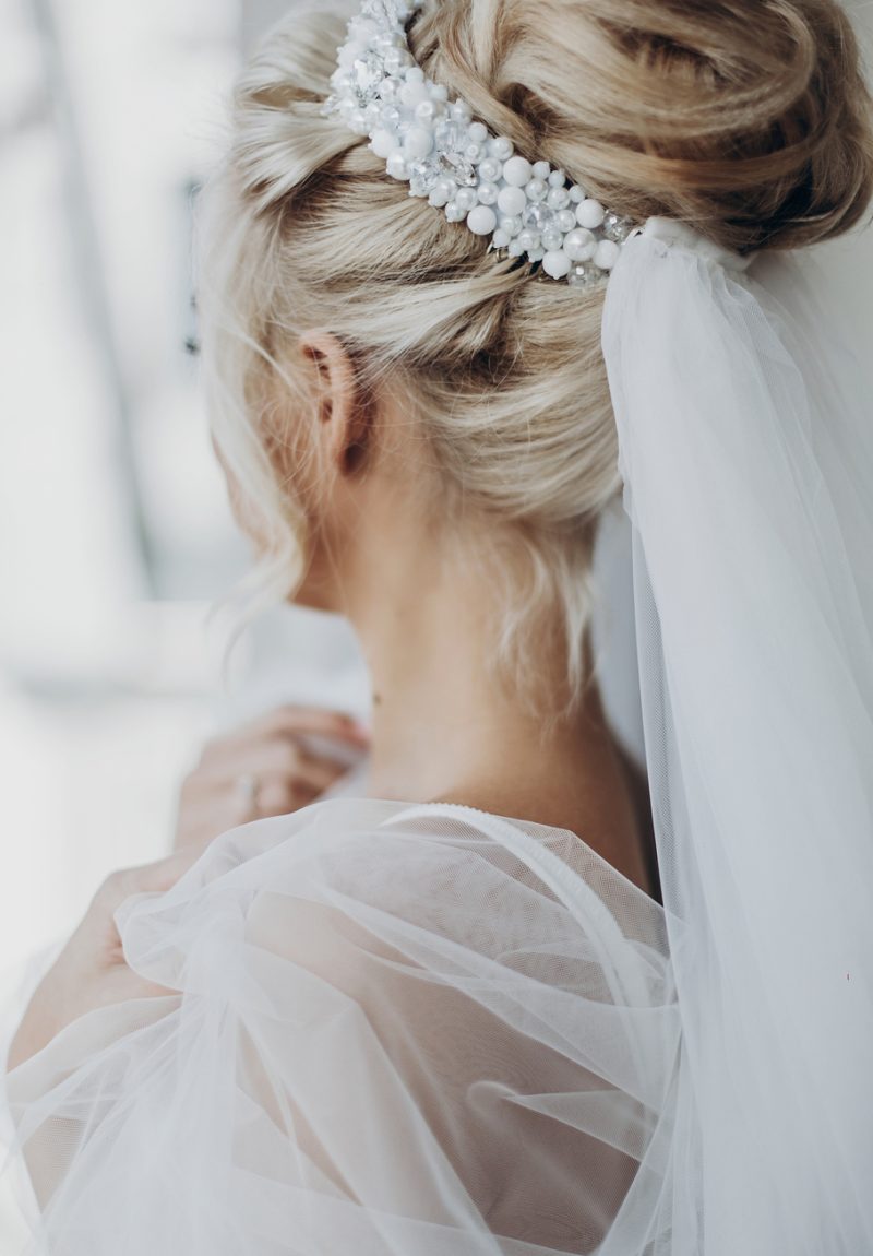 luxury beautiful bride bride hair style with pearl and veil, back view